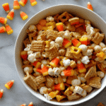 Close-up of Halloween Witches Brew Snack Mix with candy corn, popcorn, and crunchy cereal pieces