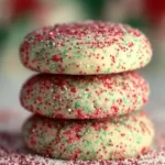 Close-up of Soft Christmas Sprinkle Cookies with colorful sugar sprinkles on white surface