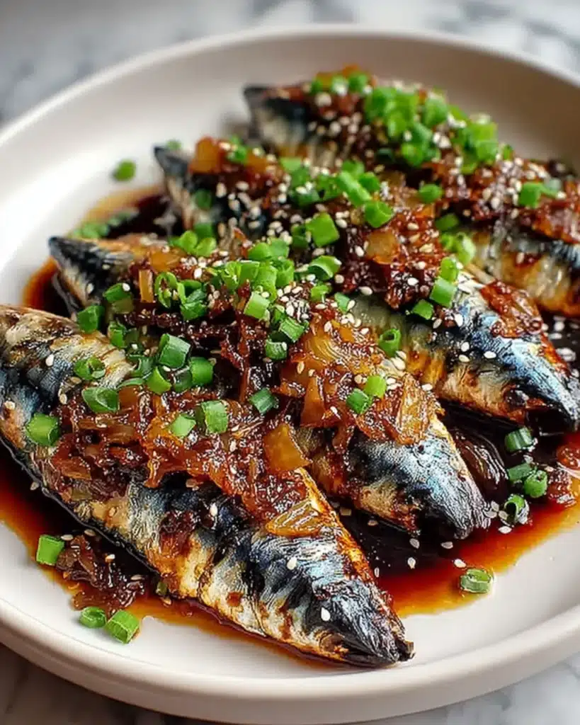 Close-up of Smoky Mackerel Bulgogi with spicy soy glaze and chopped scallions