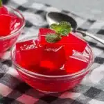 Sugar free gelatin cubes served chilled in a glass bowl