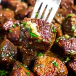 Juicy garlic butter steak bites seared in a skillet, coated in melted butter and fresh parsley for a quick dinner
