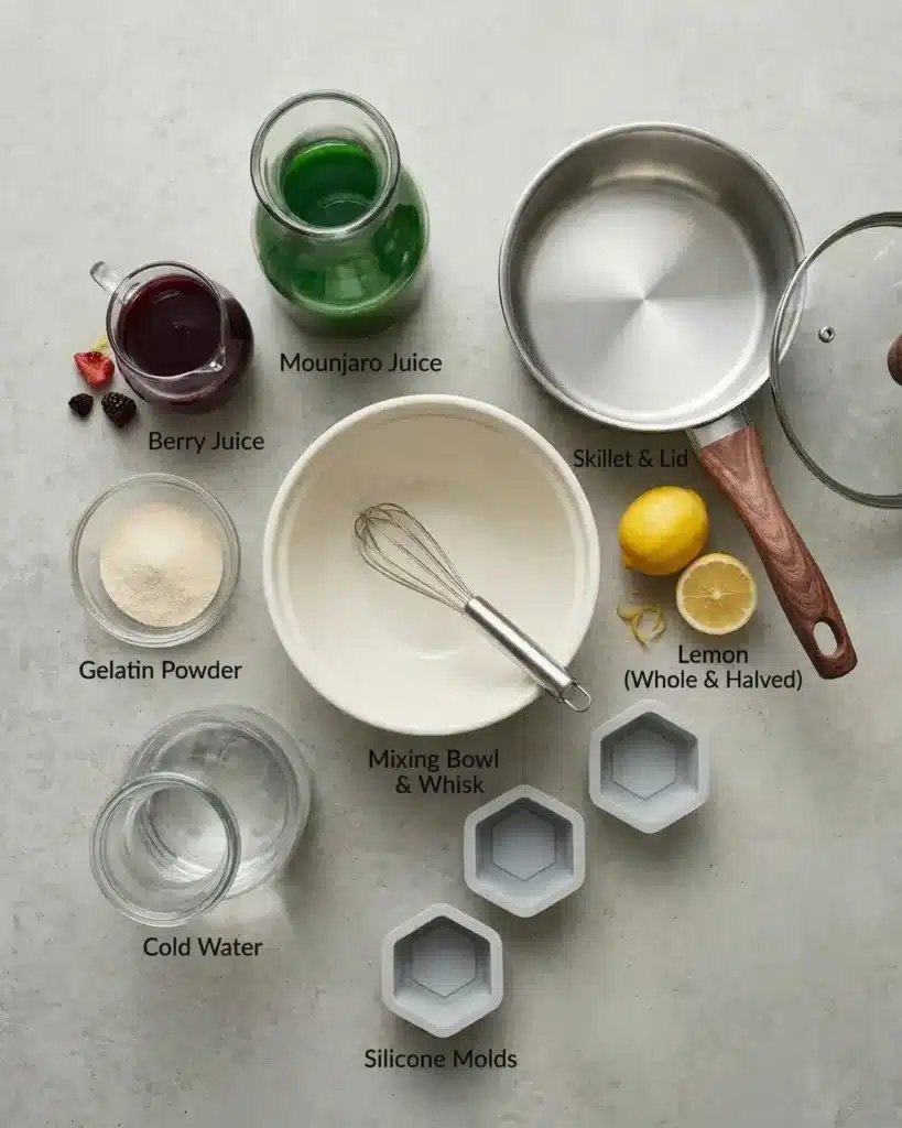 Ingredients and kitchen tools arranged for making Mounjaro Gelatin dessert including gelatin powder juice lemon saucepan and molds