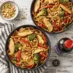 Chicken Lo Mein stir fry with chicken, noodles, broccoli, and bell peppers in a savory sauce