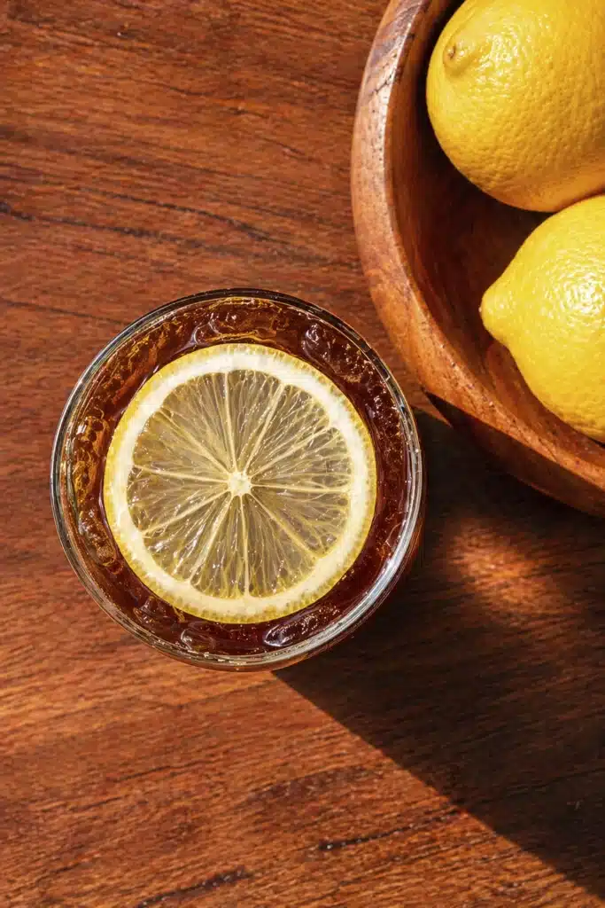 Top view of Mazagran Coffee with lemon slice and ice in glass