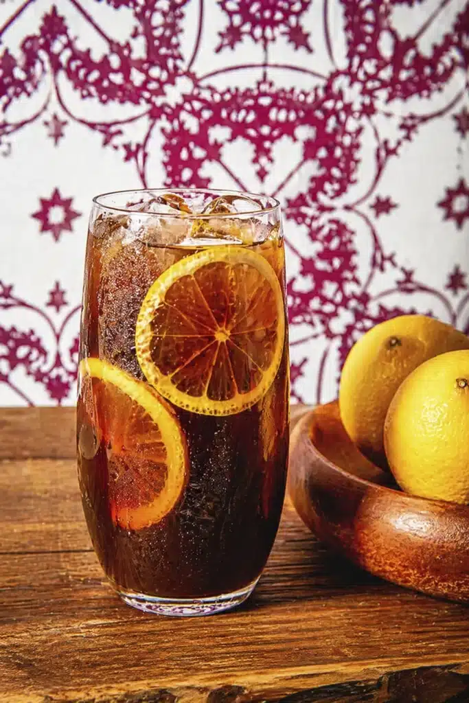 Mazagran Coffee citrus iced coffee with lemon garnish in tall glass