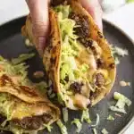 Close up Smash Burger Tacos with crispy beef melted cheese lettuce and sauce