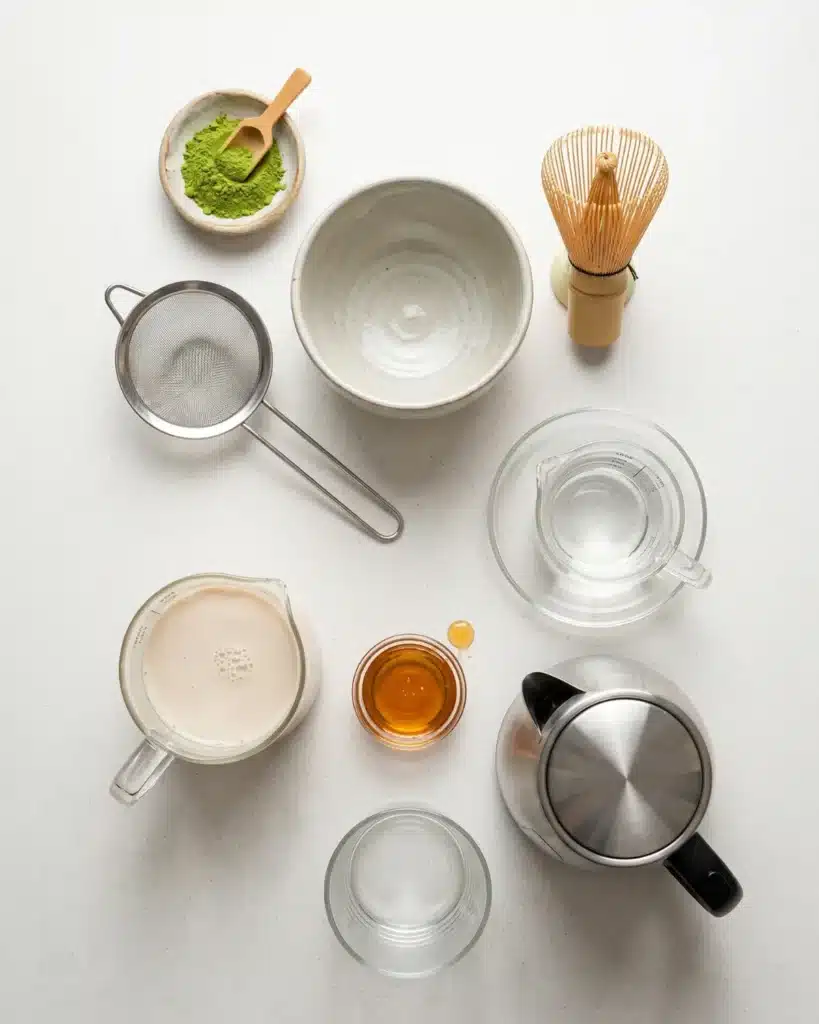 Ingredients and tools arranged for making a homemade green tea drink